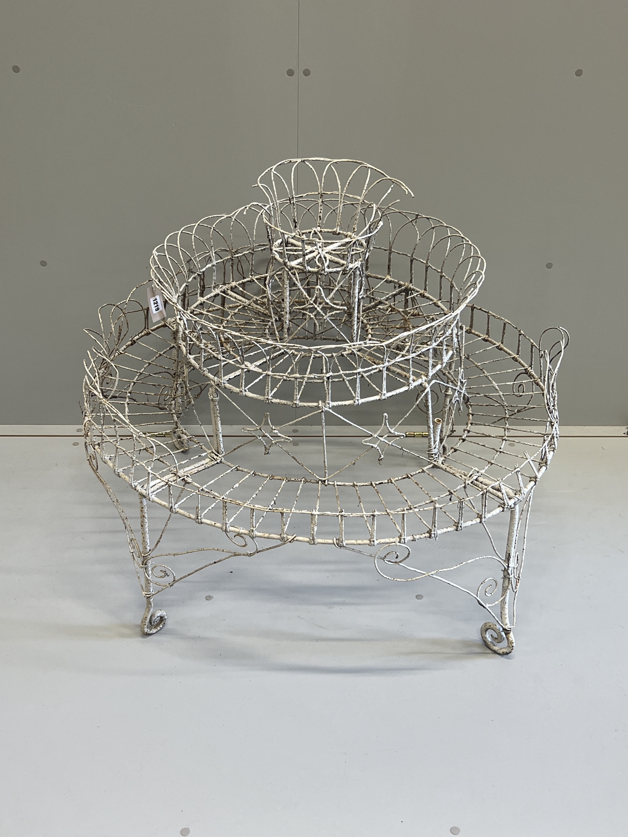 A Victorian painted wirework circular three tier pot stand, diameter 94cm, height 81cm